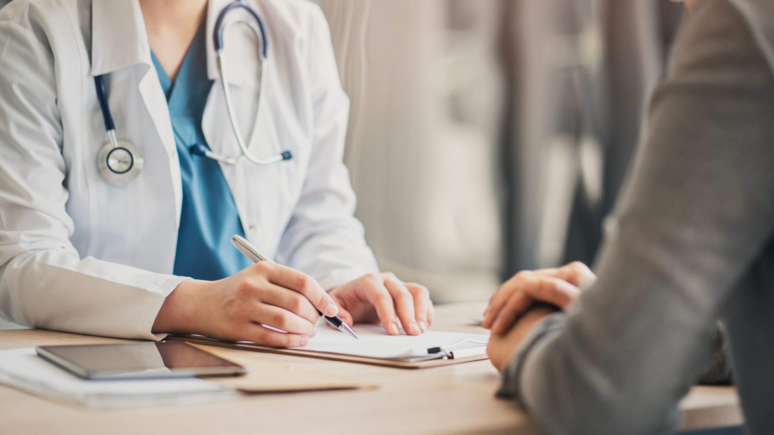 Medical appointment with doctor and patient